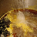 Mixing water with hot wax